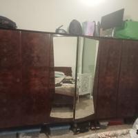 Armadio a 6 ante in radica con specchio centrale