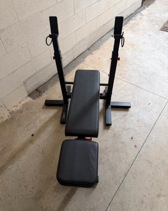 Panca palestra con bilanciere e accessori