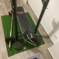 Panca piana con pesi in ghisa