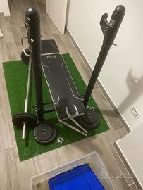 Panca piana con pesi in ghisa