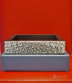 Svuotatasche con lastra d'argento.