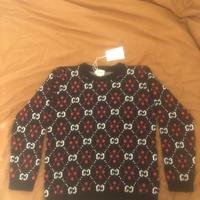 Maglione jacquard monogram Gucci.