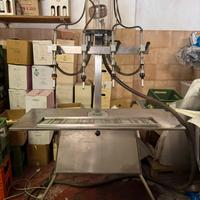 Riempitrice per vino a quattro becchi