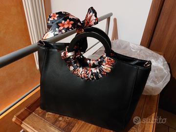 Borsa elegante Carpisa con fiocco