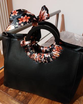 Borsa elegante Carpisa con fiocco