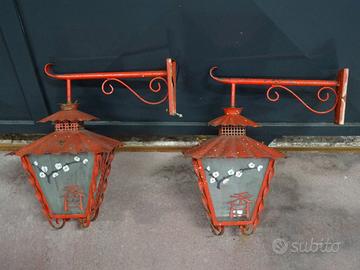Coppia di lanterne con braccio in ferro