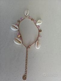 Bracciale con perline rosa e conchiglie 