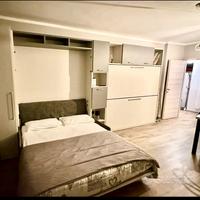 Armadio + letti ribalta con sofá per case vacanze