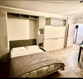 Armadio + letti ribalta con sofá per case vacanze