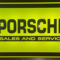 Insegna luminosa Porsche con orologio