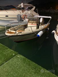 Barca, motore e carrello.