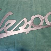 Scritta insegna VESPA