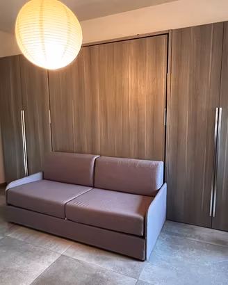 Parete attrezzata con letto e armadio 