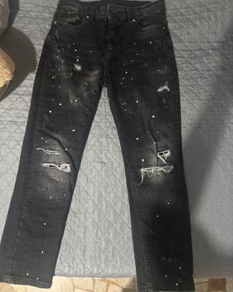 Jeans nero strappato slim fit