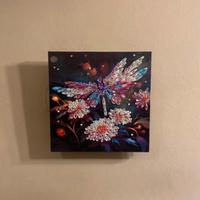 Quadro luminoso con libellula tra i fiori