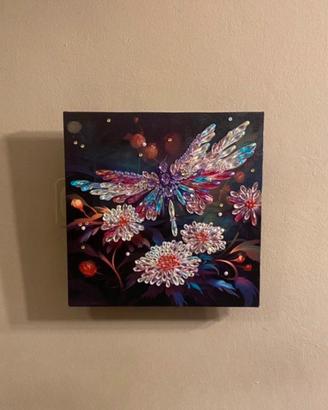 Quadro luminoso con libellula tra i fiori