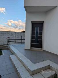 Casa con giardino