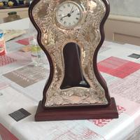 orologio a pendolo che si muove laminato argento 