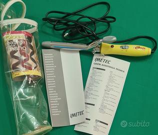 Ferro arricciacapelli e scaldacera con cera nuova