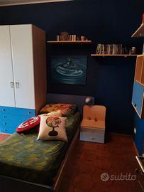 letto singolo e comodino