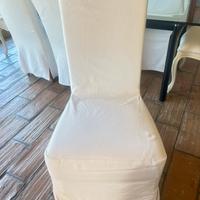 Sedie con copertura lunga bianche