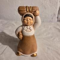 Donna con fascio legna presepe thun giubileo