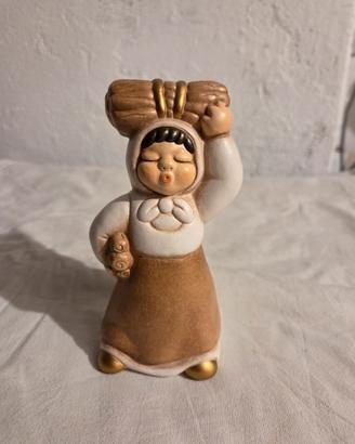 Donna con fascio legna presepe thun giubileo