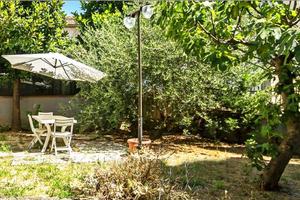 APPARTAMENTO PIANO TERRA CON GARAGE E GIARDINO
