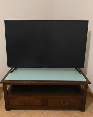 Mobile porta tv, divano letto, cassettiera, frigo.