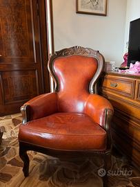 poltrone in pelle e legno di noce