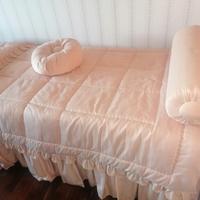 letto con testata imbottita e coordinato letto