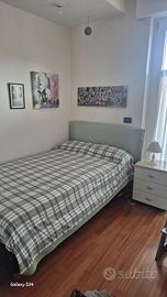 Letto una piazza e mezza con testiera imbottita