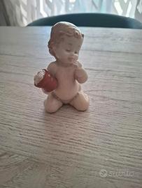 Statuetta Nao by Lladró – Putto con vaso di fiori