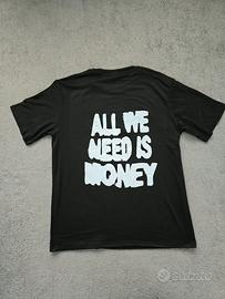 T shirt "all we need is money"