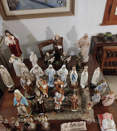 Statue santi crocifissi e arazzi stole sacerdotali