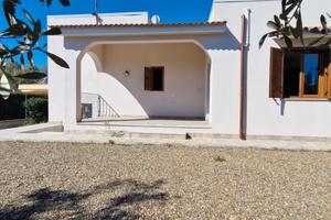 Porzione di Villa Bifamiliare con giardino