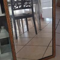 Specchio artigianale in ferro battuto.