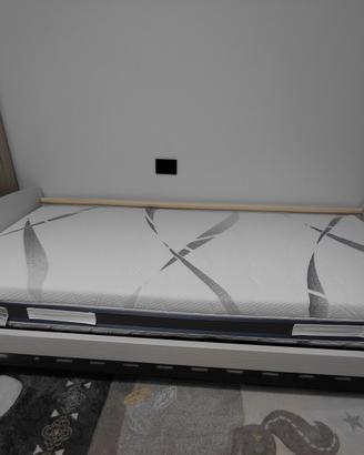 letto singolo e divano elettronico rilassante 