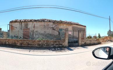 Terreno con casa