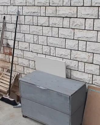 Cassapanca in legno per attrezzi giardino