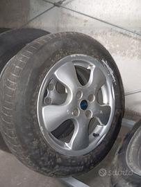 4 cerchi in lega + gomme invernali per Cubo Fiorin