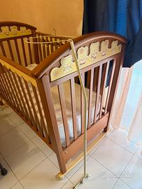 Culla dondolo pali
