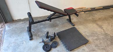 panca richiudibile e pesi  per palestra