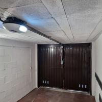 Automazione basculante con motore a traino