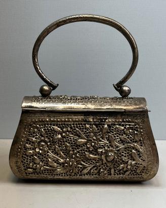 Pochette metallo traforato
