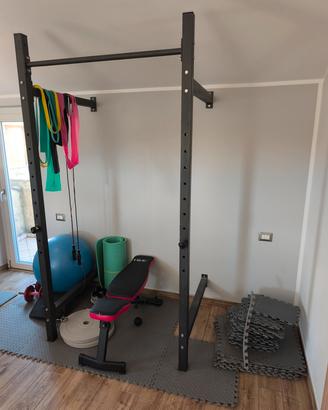 Rack fissa a parete con bilanciere  e 2 pesi 