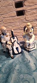  coppia di statuette musicisti in porcellana 