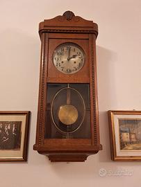 Orologio a pendolo da parete vintage