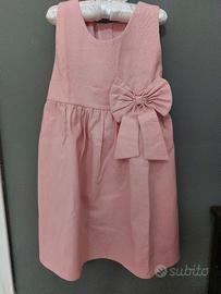 Abito rosa senza maniche in cotone con cintura.