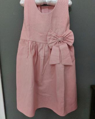 Abito rosa senza maniche in cotone con cintura.